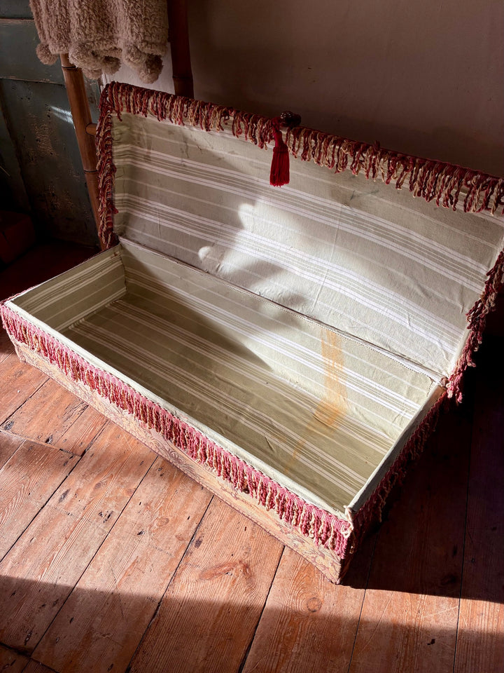 French Upholstered Storage Trunk - Bridal Trunk showing open interior lined in ticking fabric with tassel trim.
