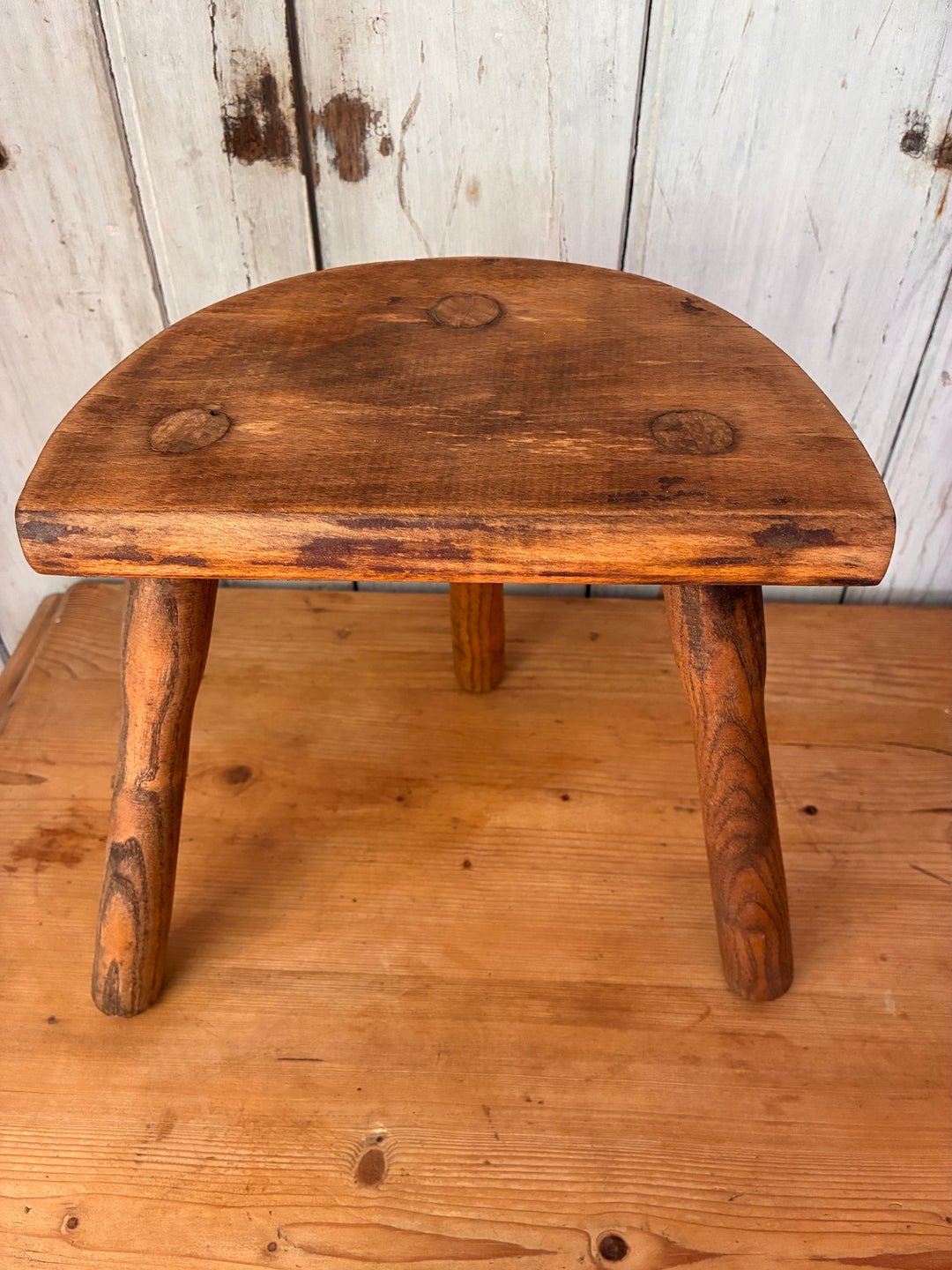 Vintage Wooden French Tripod Stool with demi-lune seat and three sturdy legs, showcasing rustic style.