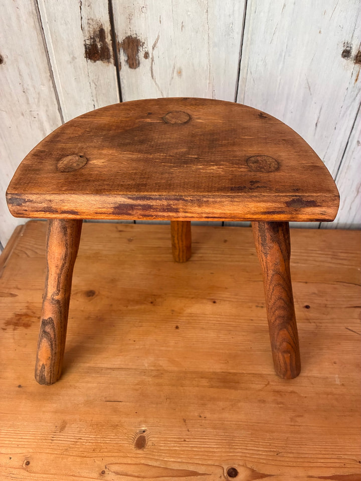 Vintage Wooden French Tripod Stool with demi-lune seat and three sturdy legs, showcasing rustic style.