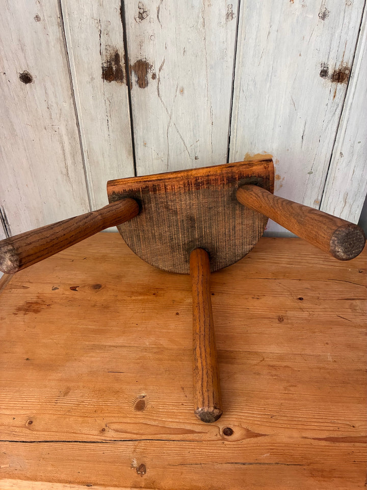 Vintage Wooden French Tripod Stool top view showing three sturdy legs and demi-lune shaped seat, rustic style accent.