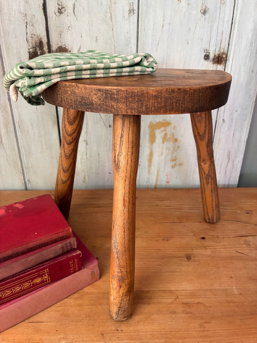 Vintage Wooden French Tripod Stool with a demi-lune seat and rustic legs, perfect for vintage decor.