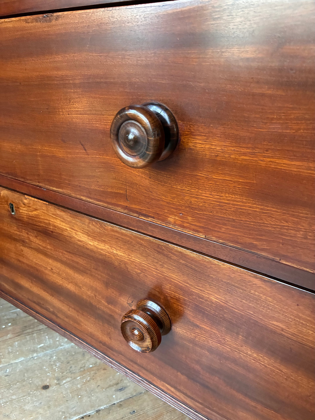 Two antique mahogany drawer handles on a Georgian Antique Mahogany Chest of Drawers from Source for the Goose Devon.