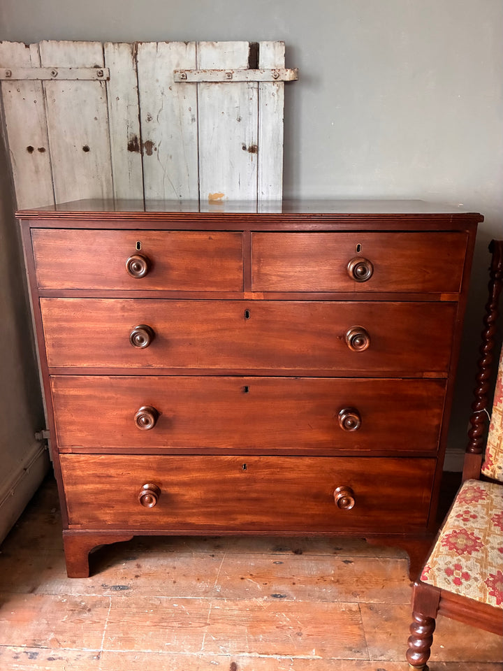 Georgian Antique Mahogany Chest of Drawers with six drawers showcasing timeless elegance and craftsmanship.