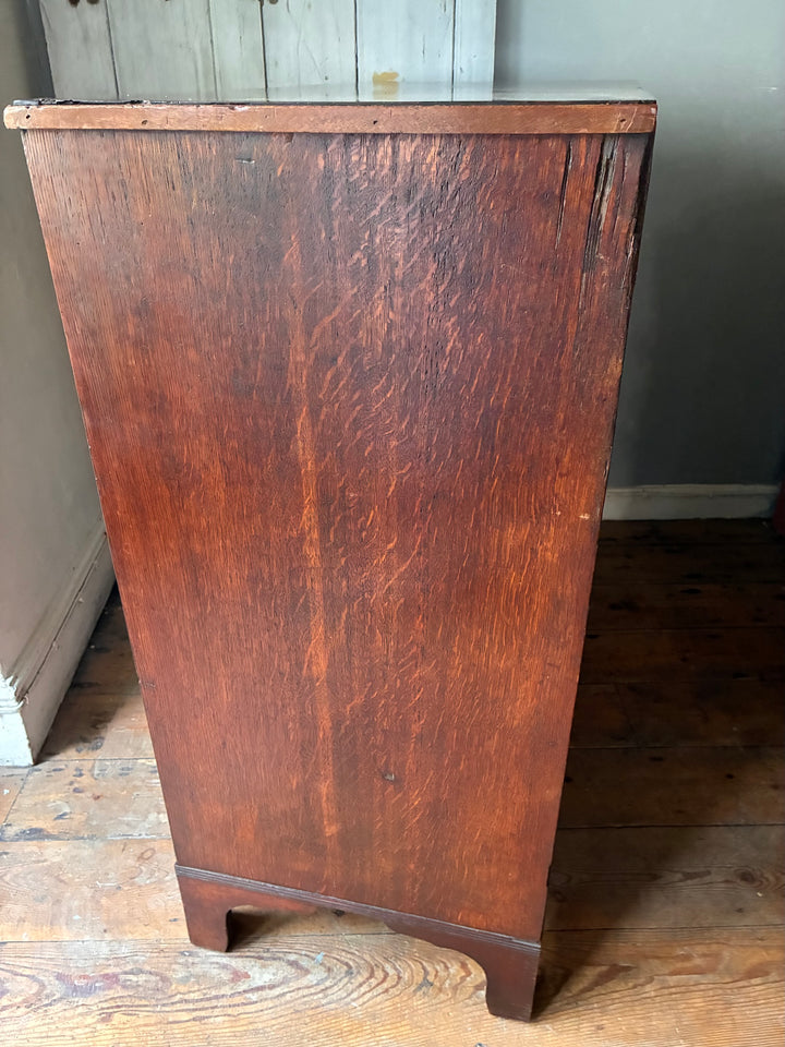 Georgian Antique Mahogany Chest of Drawers showcasing rich wood grain and traditional design elements.