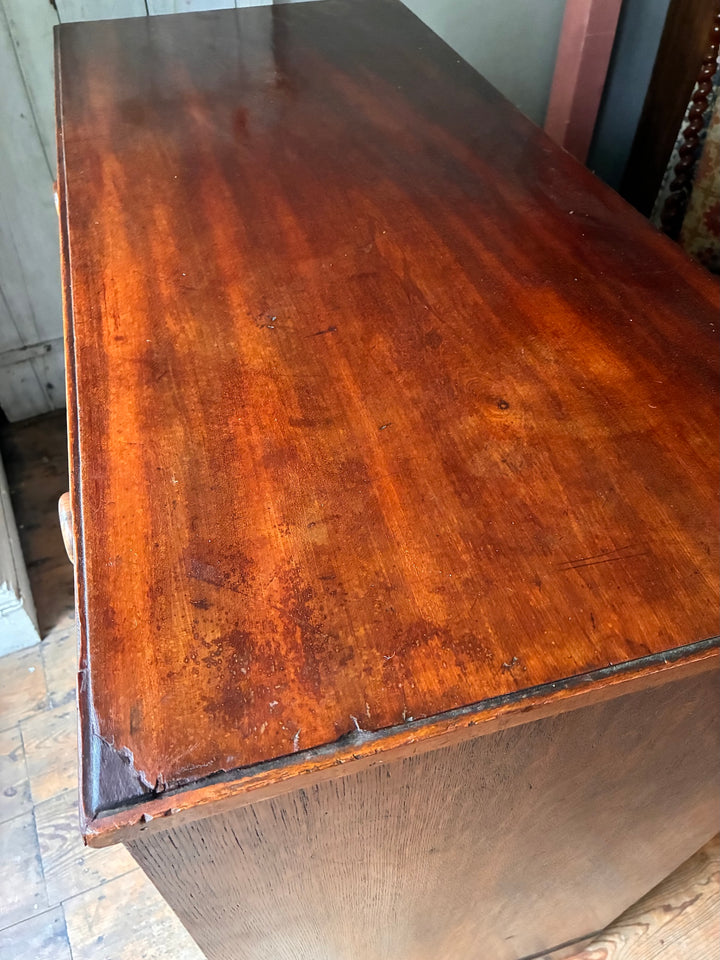 Georgian Antique Mahogany Chest of Drawers showcasing its polished wooden surface and elegant finish.