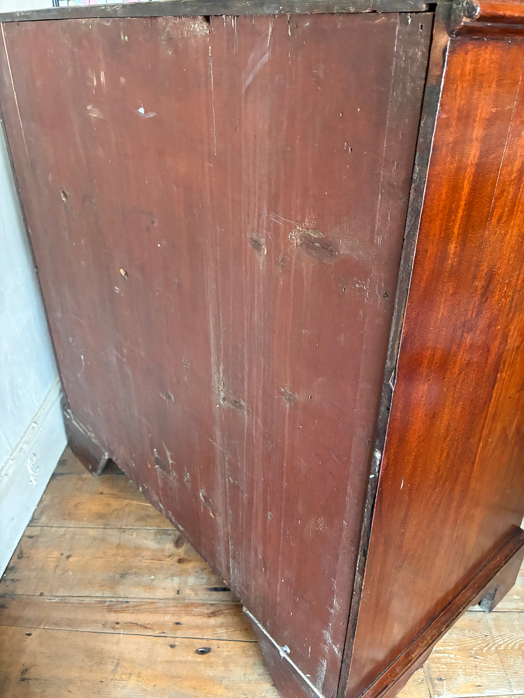 Side view of an Antique Georgian Mahogany Chest of Drawers showcasing its rich wood and classic design.