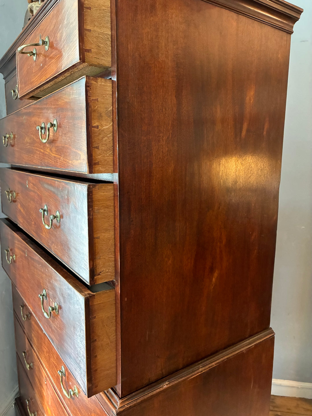 Georgian Mahogany Tall Boy - Chest on Chest showcasing antique mahogany craftsmanship with elegant brass handles.