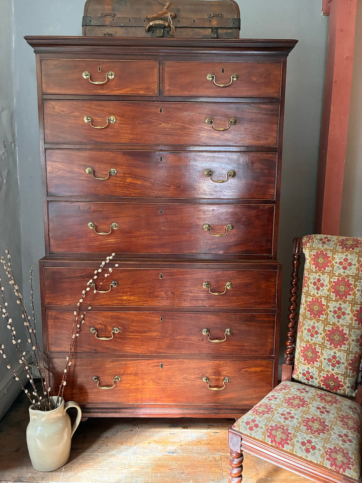 Georgian Mahogany Tall Boy - Chest on Chest featuring eight drawers and brass handles, embodying antique mahogany craftsmanship.