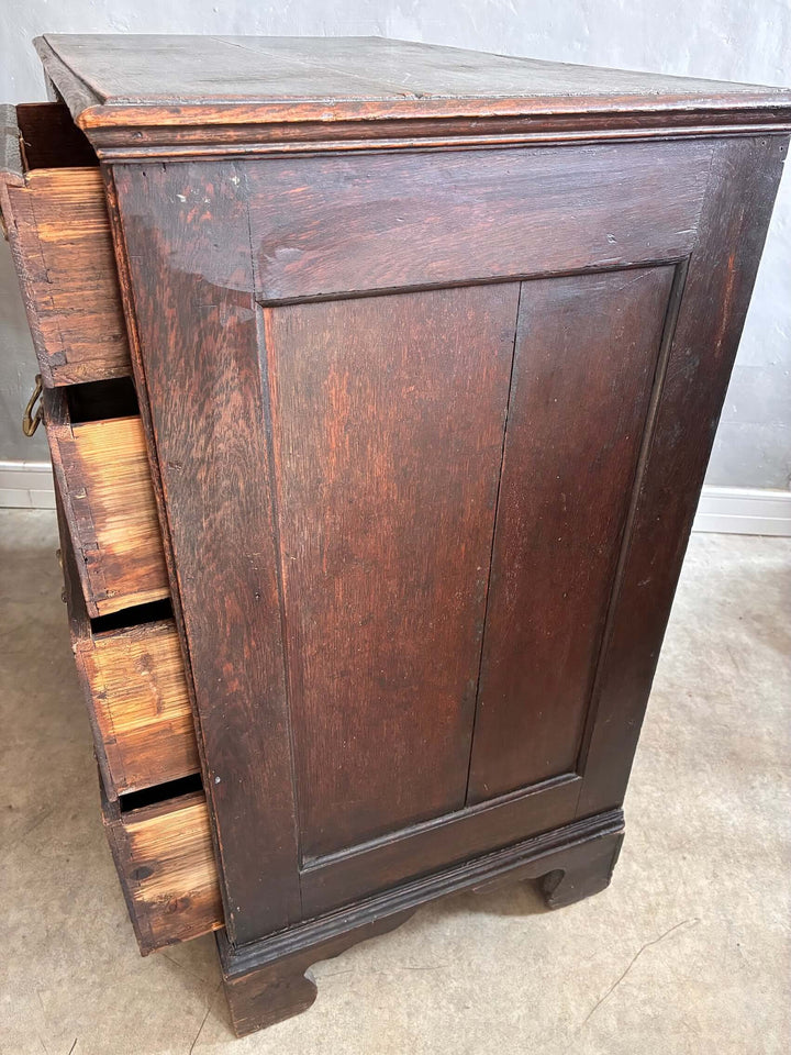 Antique Oak Georgian Chest of Drawers with classic design and brass escutcheons, featuring spacious drawers and bracket feet.