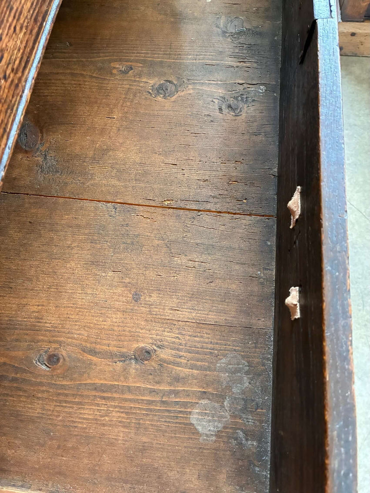 Interior view of an Antique Oak Georgian Chest of Drawers showcasing its rustic wooden finish and craftsmanship from Source for the Goose.