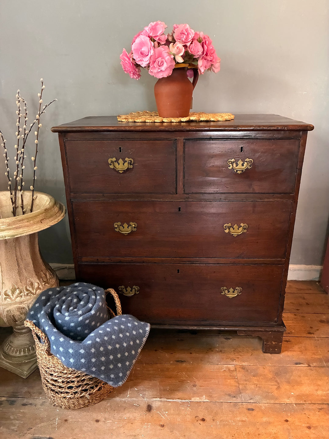 Antique Oak Chest of Drawers - Georgian with brass drop handles and rustic decor in a charming room.