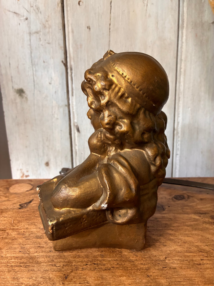 Antique Gilded Plaster Bust - Girl Reading Book - The Dreamer side view with golden finish on wood background.