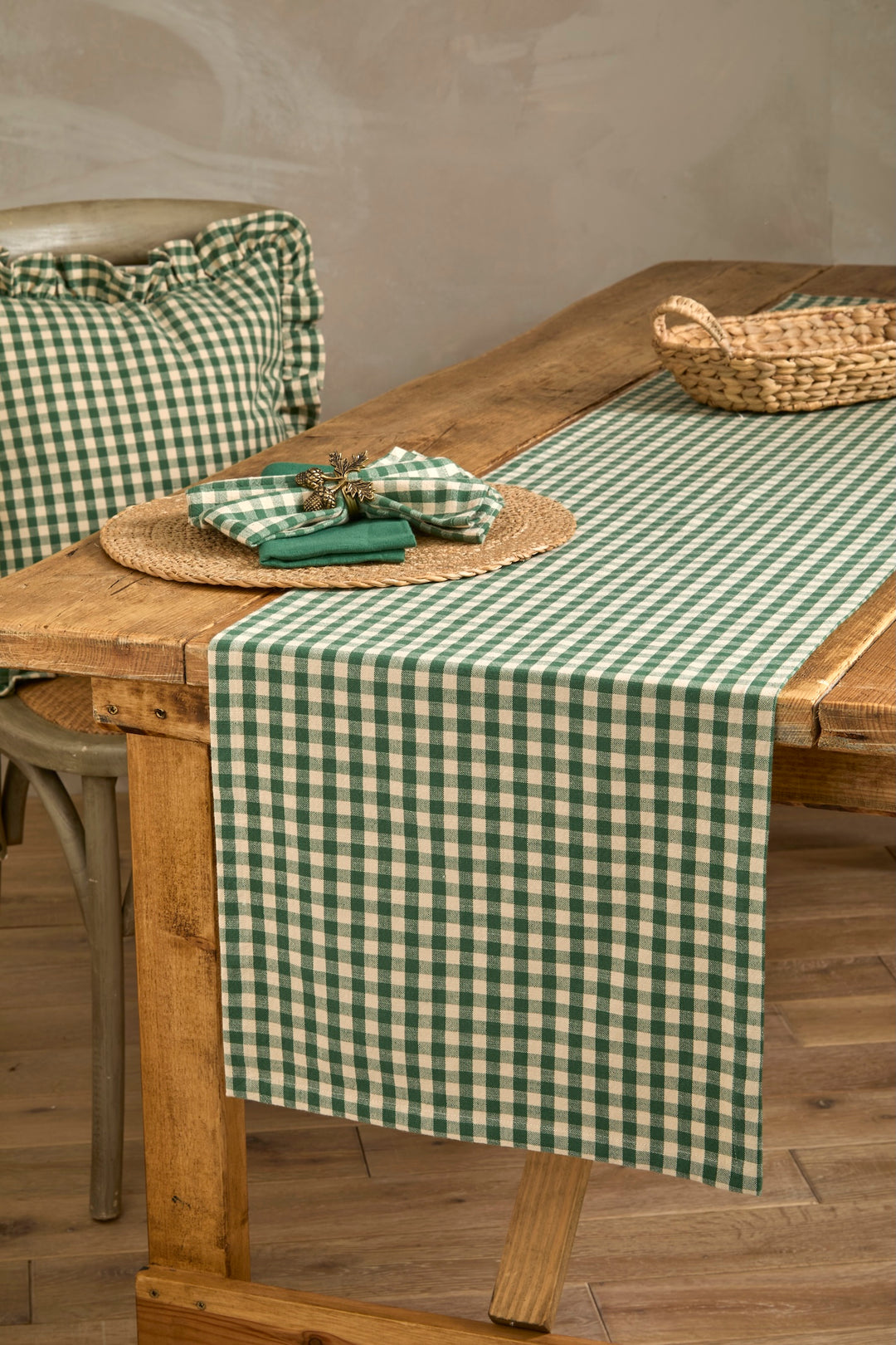 Forest Green Gingham Napkin Set - Set of Four displayed on a rustic wooden table with natural decor.