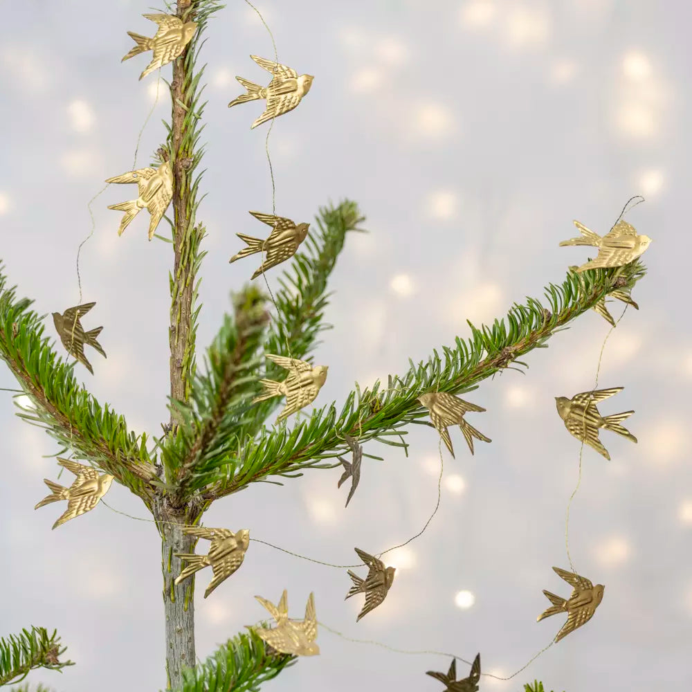 Gold Bird Garland on Wire featuring golden swifts adorning a tree, perfect for elegant festive decor.