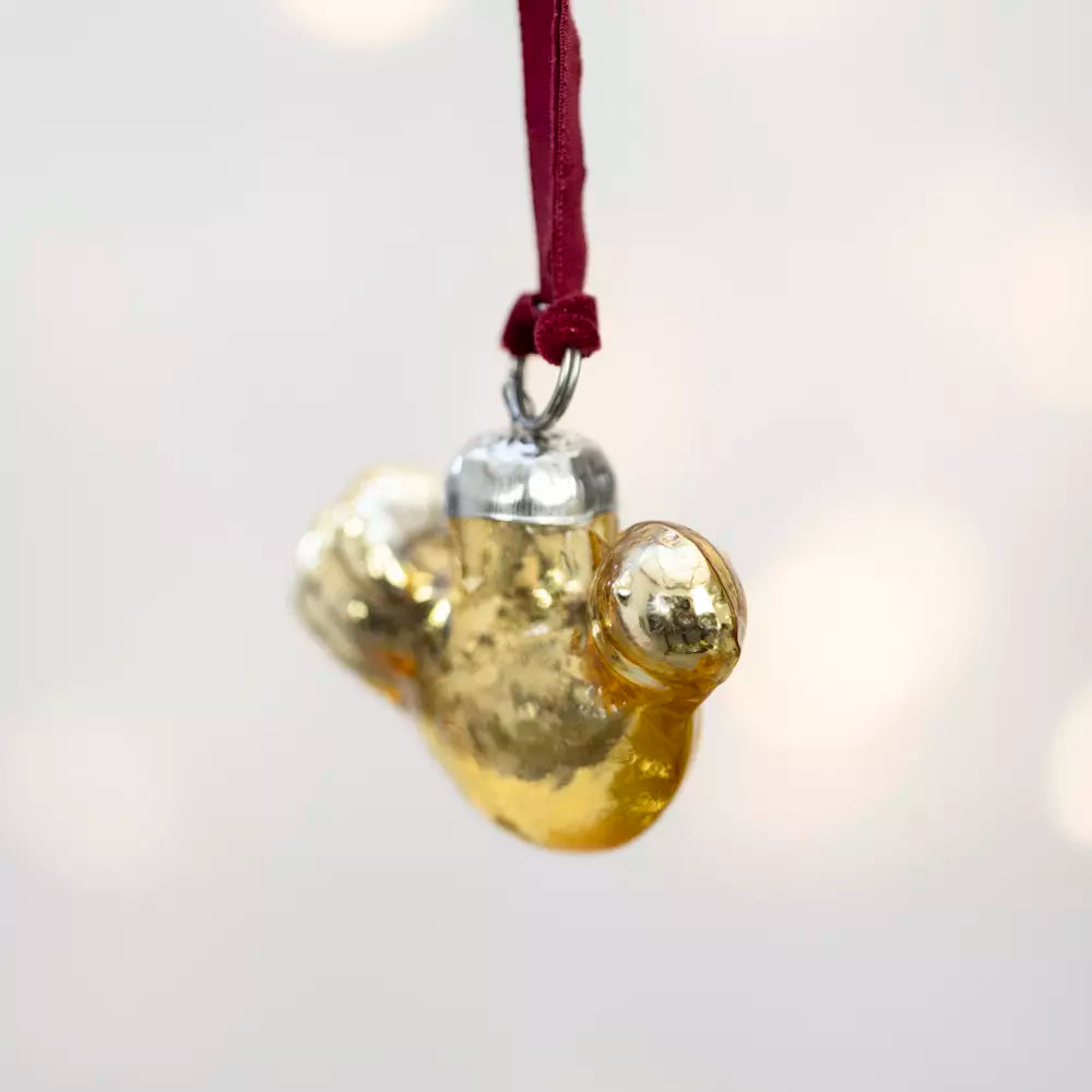 Gold Glass Bird Decoration With Velvet Loop hanging from a red velvet ribbon.