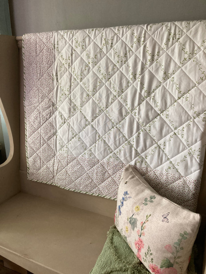 small quilt with disty floral border and green trellis design