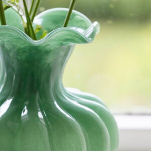 Green Glass Vase with Frill Rim - Bethany showcasing delicate flowers by Source for the Goose Devon.