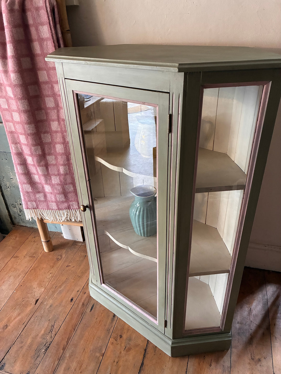 Soft Green Corner Display Cabinet with glass doors and shelves, perfect for showcasing collectibles, from Source for the Goose, Devon.