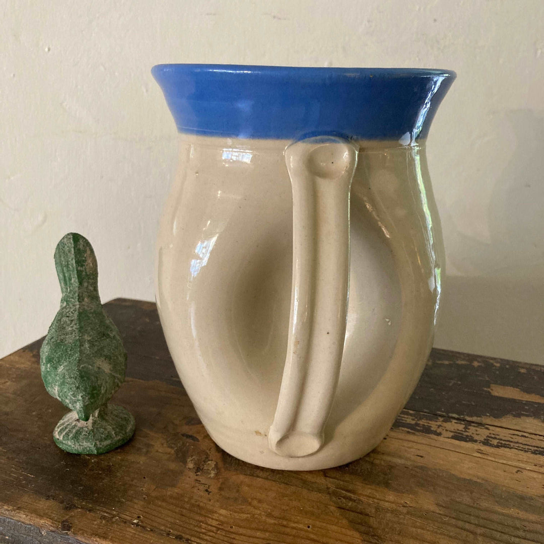 unusual handle on back of stoneware jug