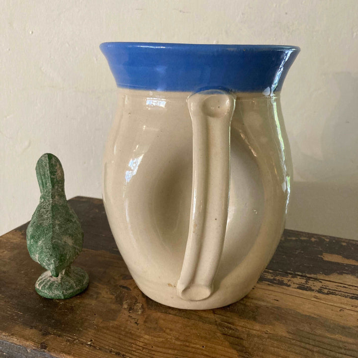 unusual handle on back of stoneware jug