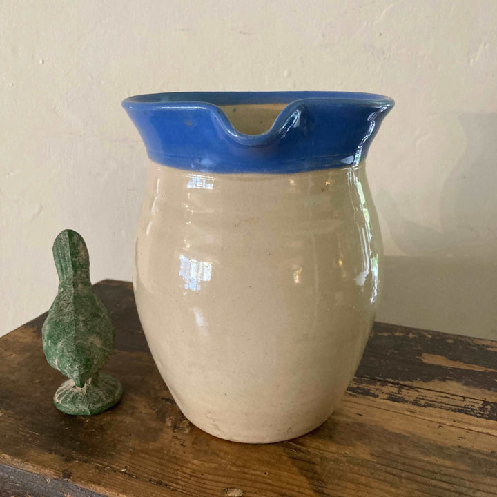 blue rim and glazed exterior on stoneware jug