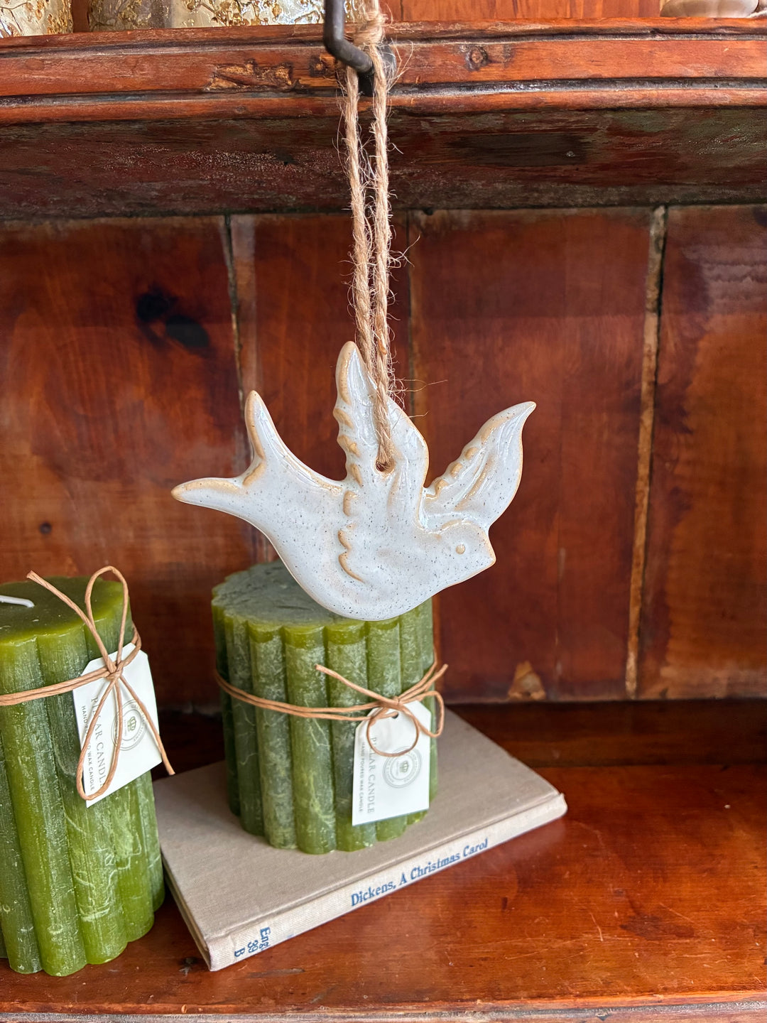 Christmas Ceramic Dove Decoration hanging with rustic twine, enhancing festive decor from Source for the Goose Devon.