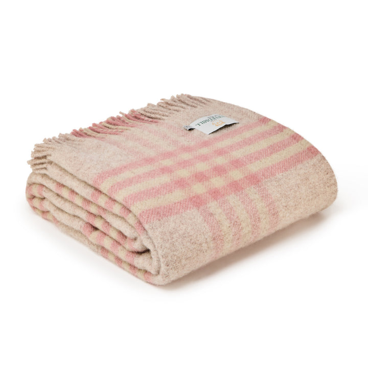 Tweedmill Dusky Pink Check Wool Throw folded with tassels on a white background, ideal for adding warmth and elegance.