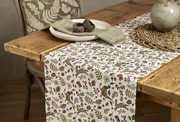 Into The Woods Rustic Table Runner featuring charming forest animals on a dining table with rustic decor.