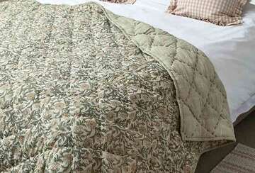 Floral Olive Green Kantha Bedspread by Source for the Goose, Devon, showcasing vintage charm and cozy texture.