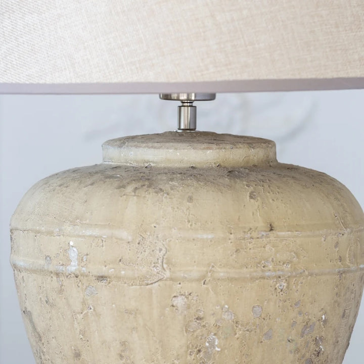 Marius Lamp - Stoneware Base With Woven Linen Shade featuring a textured stoneware jar base.