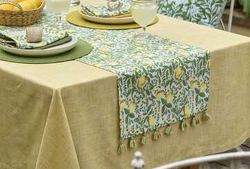 Summery Lemon Design Table Runner by Source for the Goose, featuring green and yellow patterns and tassels, perfect for summer decor.