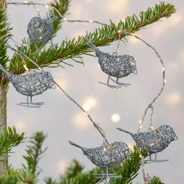 Light Up Wire Bird Garland - Antique Grey featuring LED lit wire birds on a green garland.