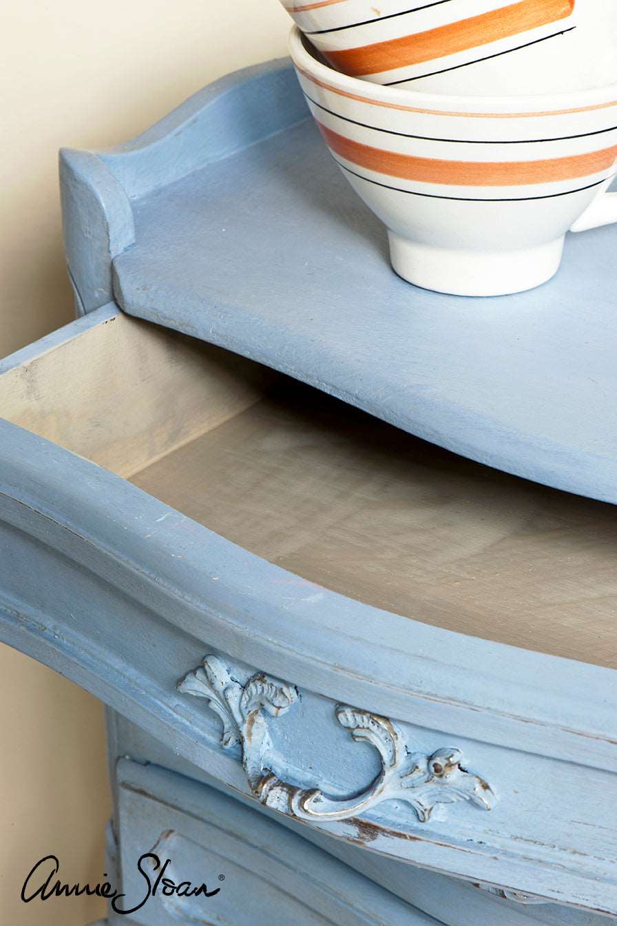 close up of Louis Blue Chalk paint that has been slightly distressed