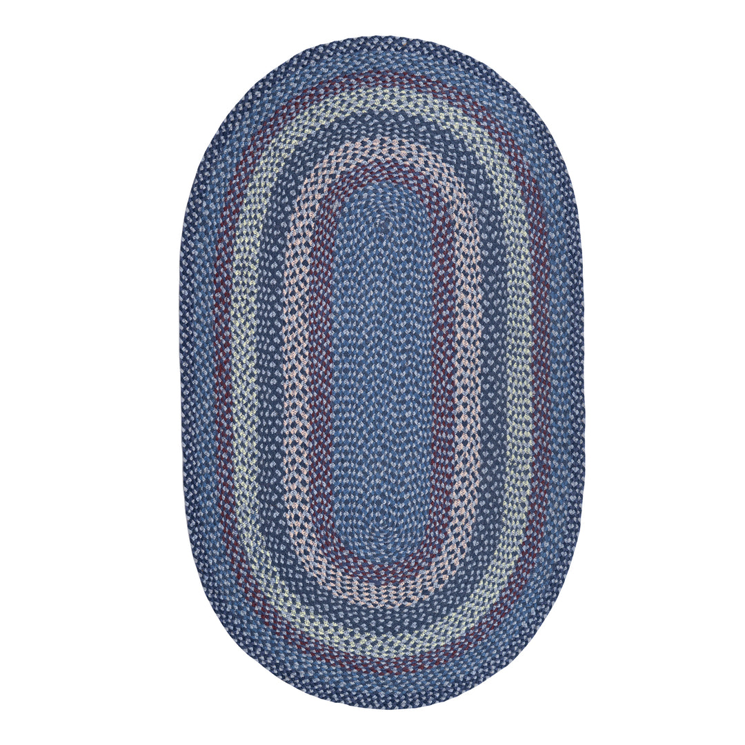 Lupin Blue Organic Oval Jute Braided Rug showcasing muted colors and natural texture, ideal for contemporary and traditional spaces.