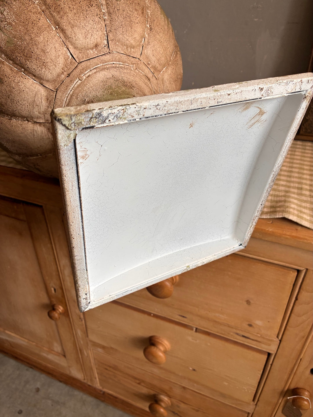 Medici Style Urn Planter displayed with vintage wooden cabinet and home decor accents.