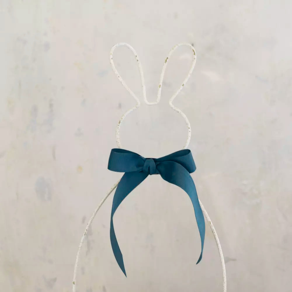 Metal Bunny Basket - Antique White with blue ribbon bow on a wire bunny silhouette.