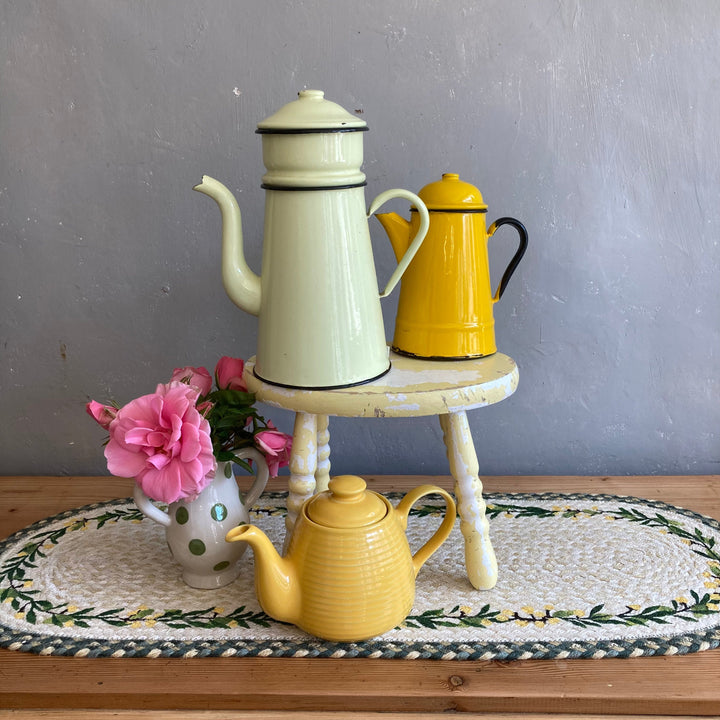 mix of vintage yellow china and enamelware