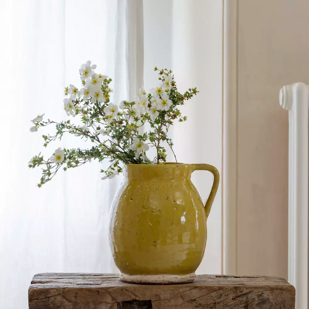 Mustard Yellow Rustic Glazed Jug filled with fresh flowers on a wooden table, perfect for decor.