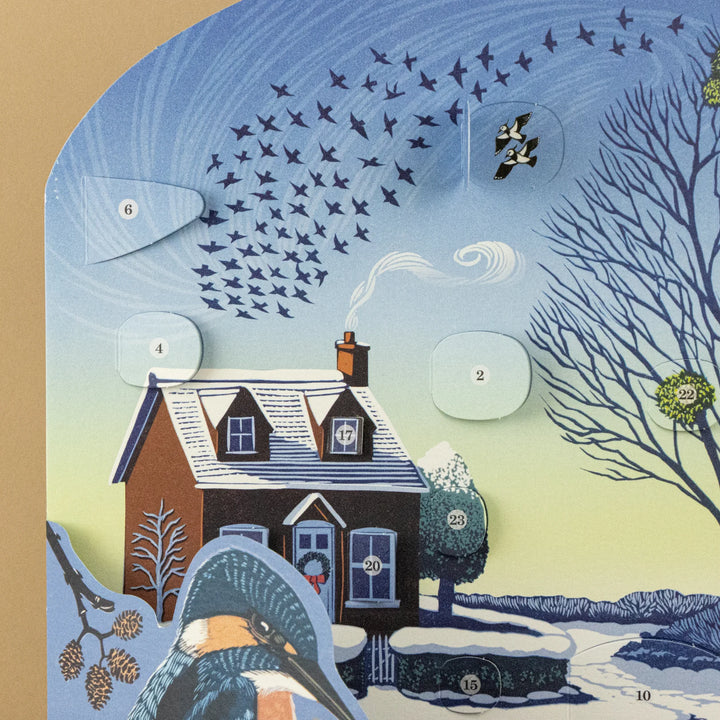 Winter Riverside Advent 2026 Calendar - Niki Bowers with snowy cottage and festive scenes.