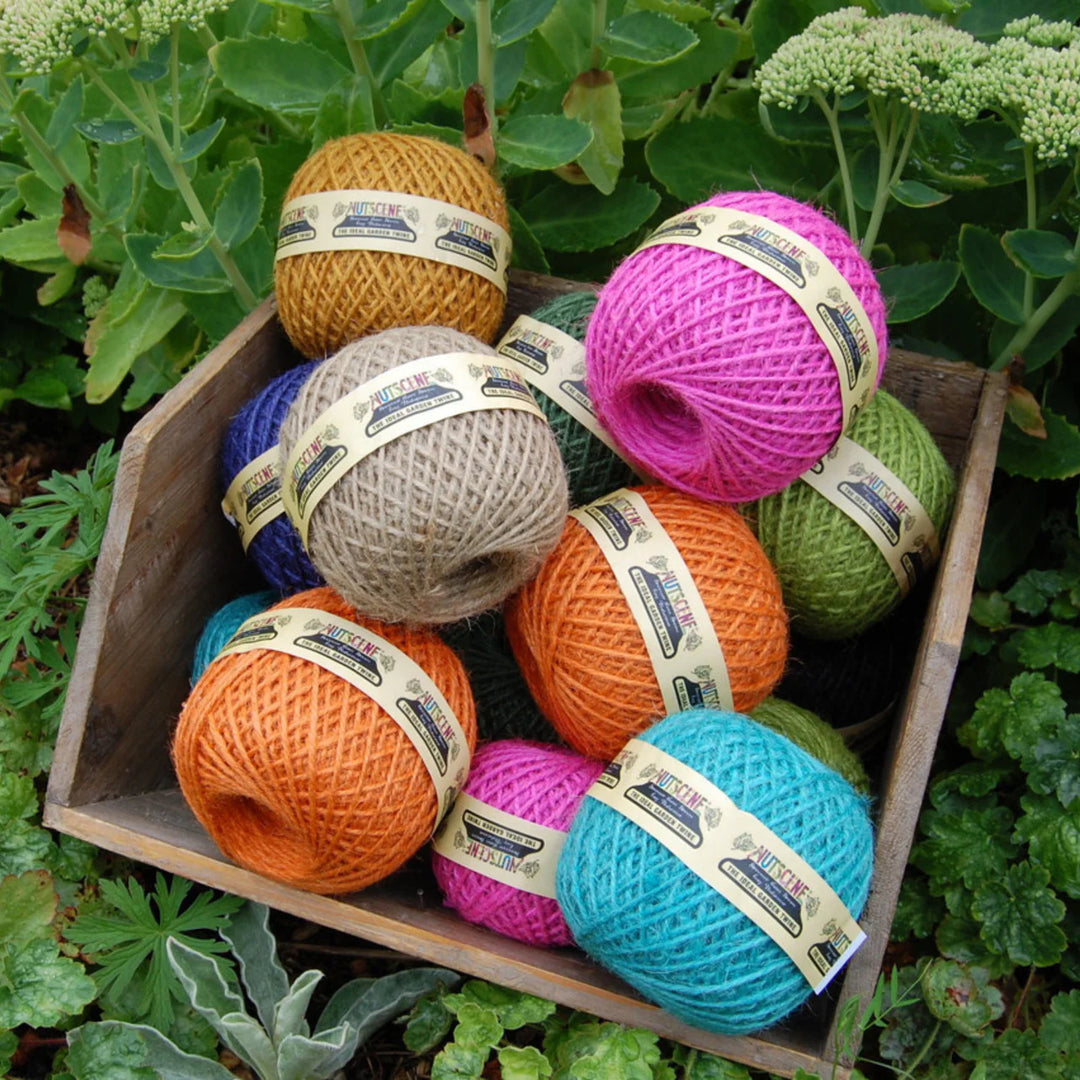 Nutscene Heritage Colourful Jute Twine Ball - Small in vibrant colors displayed in a wooden box, perfect for crafts or gardening.
