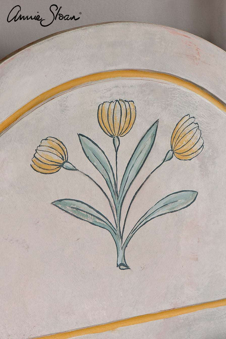 Bed head painted in Old Ochre Chalk Paint with flower stencil