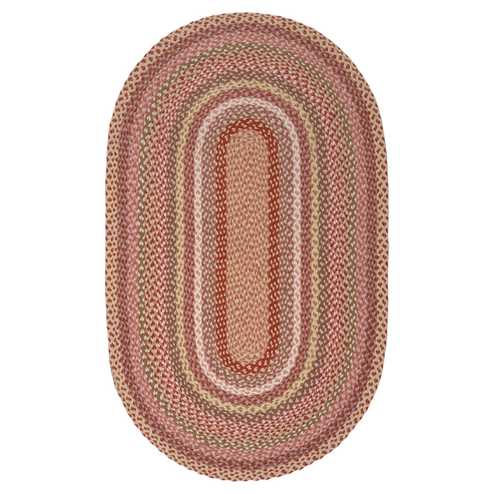 Coral pink organic jute braided oval rug with taupe and cream rings, ideal for stylish home decor from Source for the Goose, Devon.