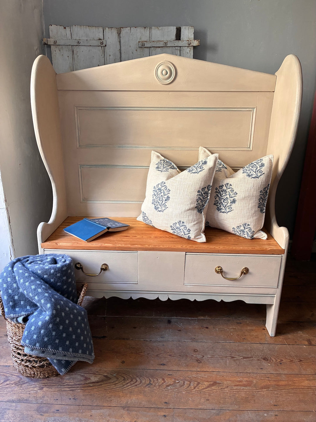 Painted Pine Monks Bench with blue patterned cushions and hidden storage, available from Source for the Goose Devon.