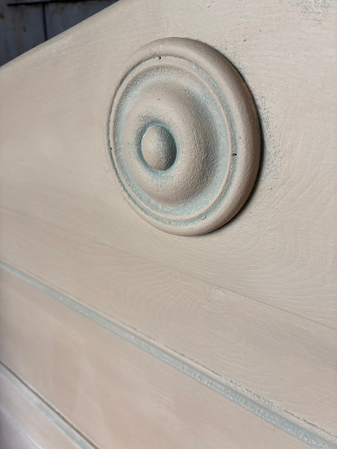 Close-up of the decorative roundel detail on the Painted Pine Monks Bench from Source for the Goose, Devon.