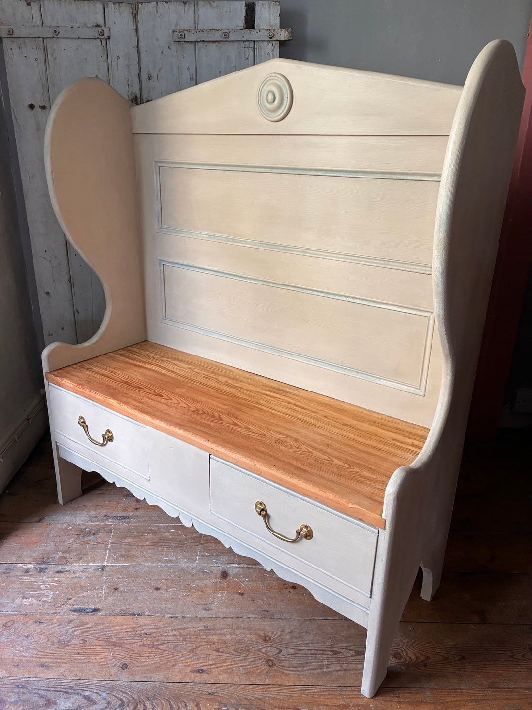 Painted Pine Monks Bench featuring a high panelled back and decorative details, perfect for rustic decor.