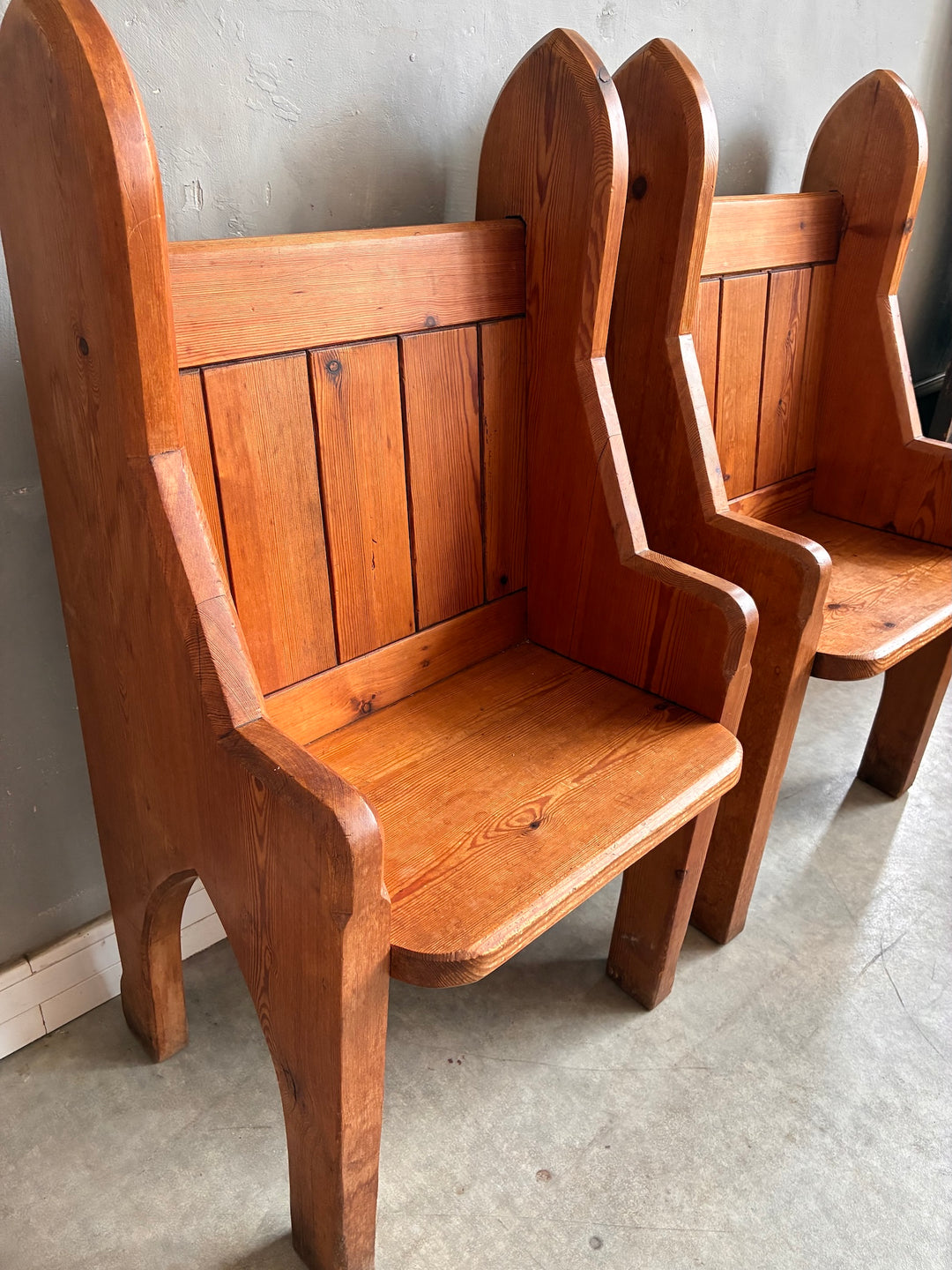 Pair of Small Pine Church Pews showcasing rustic charm and panelled backrest in solid pine.