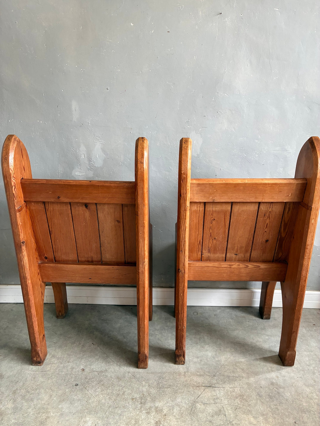 Pair of Small Pine Church Pews showcasing rustic charm with panelled backrest and arched legs.