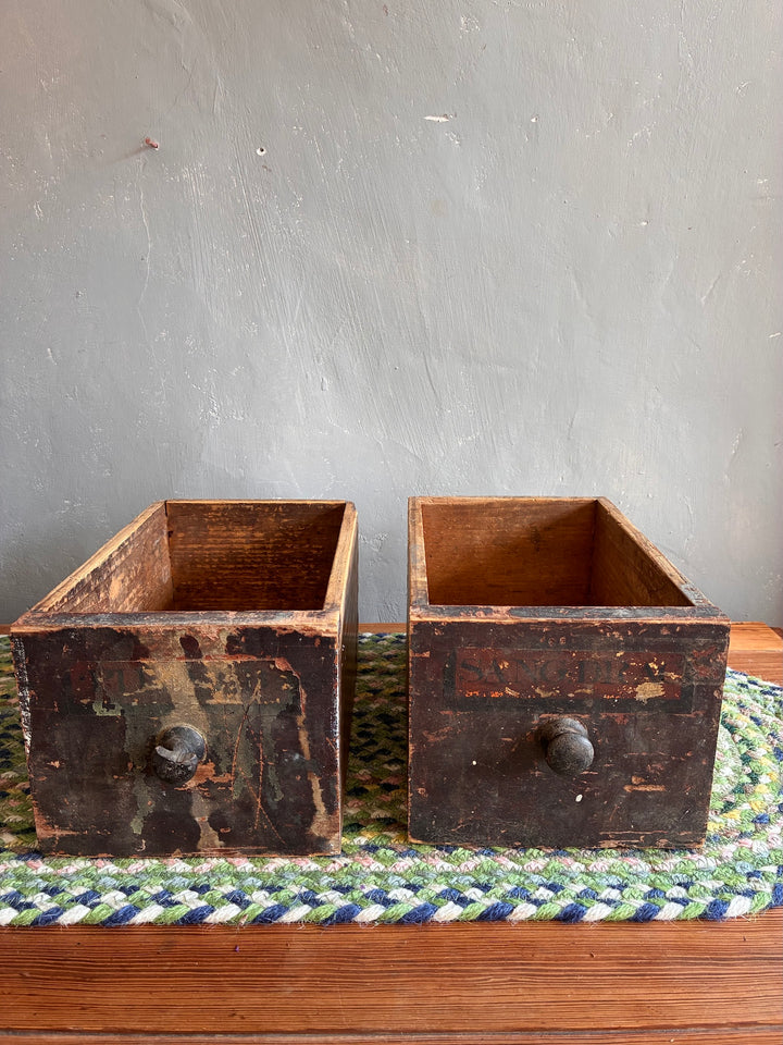 Pair of vintage apothecary drawers from Source for the Goose, Devon, displaying rustic charm and unique patina.