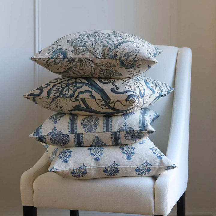 Mix of blue and linen colour cushions on a chair