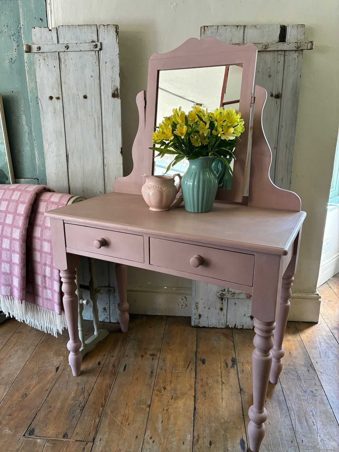 Hand-painted pink dressing table with mirror and flowers, perfect for a vintage-inspired bedroom by Source for the Goose, Devon.